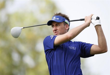 Ian Poulter of England watches his shot from the second tee during the first round of the DP World Tour Championship at Jumeirah Golf Estate Ian Poulter of England watches his shot from the second tee during the first round of the DP World Tour Championship at Jumeirah Golf Estate