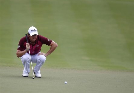 Rory McIlroy of Northern Ireland lines up his shot on the third green during the third round of the DP World Championship at Jumeirah Golf E Rory McIlroy of Northern Ireland lines up his shot on the third green during the third round of the DP World Championship at Jumeirah Golf E