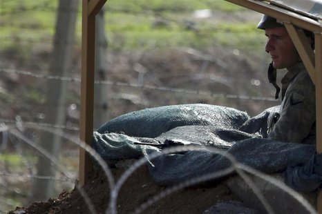 A Turkish soldier takes up his position near the border with Syria as seen from the Turkish border town of Ceylanpinar, Sanliurfa province, A Turkish soldier takes up his position near the border with Syria as seen from the Turkish border town of Ceylanpinar, Sanliurfa province,