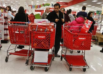 People shop at a Target store in Westbury, New York November 23, 2012. Black Friday, the day following the Thanksgiving Day holiday, has tra People shop at a Target store in Westbury, New York November 23, 2012. Black Friday, the day following the Thanksgiving Day holiday, has tra