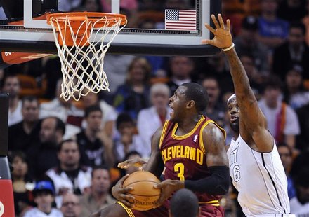 Miami Heat's LeBron James (R) defends Cleveland Cavaliers' Dion Waiters (L) during the first half of their NBA basketball game in Miami, Flo Miami Heat's LeBron James (R) defends Cleveland Cavaliers' Dion Waiters (L) during the first half of their NBA basketball game in Miami, Flo