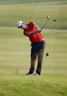 Justin Rose of England hits a shot at the 18th hole during the first round of the DP World Tour Championship at Jumeirah Golf Estates in Dub Justin Rose of England hits a shot at the 18th hole during the first round of the DP World Tour Championship at Jumeirah Golf Estates in Dub