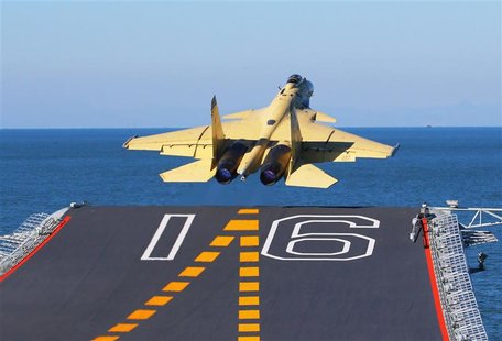A carrier-borne J-15 fighter jet takes off from the Liaoning, China's first aircraft carrier, in this undated handout photo released Novembe A carrier-borne J-15 fighter jet takes off from the Liaoning, China's first aircraft carrier, in this undated handout photo released Novembe