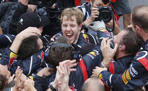 Red Bull Formula One driver Sebastian Vettel of Germany celebrates winning the world championship with his team after finishing sixth in the Red Bull Formula One driver Sebastian Vettel of Germany celebrates winning the world championship with his team after finishing sixth in the