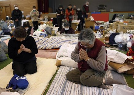 Victims of the March 11 earthquake and tsunami observe a minute of silence at a shelter in Kamaishi, Iwate prefecture, in this April 11, 201 Victims of the March 11 earthquake and tsunami observe a minute of silence at a shelter in Kamaishi, Iwate prefecture, in this April 11, 201