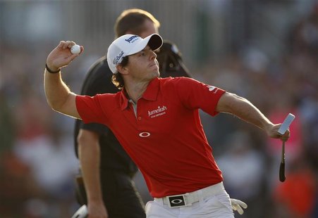 Rory McIlroy of Northern Ireland celebrates at the 18th green after the fourth and final round of the DP World Tour Championship at Jumeirah Rory McIlroy of Northern Ireland celebrates at the 18th green after the fourth and final round of the DP World Tour Championship at Jumeirah