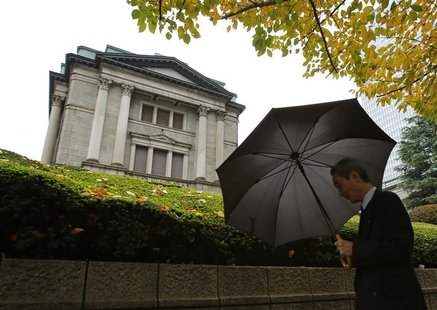 A man walks past the Bank of Japan (BOJ) headquarters in Tokyo November 26, 2012. Bank of Japan Governor Masaaki Shirakawa urged the governm A man walks past the Bank of Japan (BOJ) headquarters in Tokyo November 26, 2012. Bank of Japan Governor Masaaki Shirakawa urged the governm