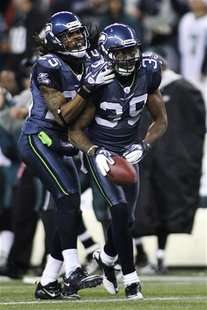 Seattle Seahawks cornerback Brandon Browner (39) is congratulated by teammate Richard Sherman (L) after Browner intercepted a pass intended Seattle Seahawks cornerback Brandon Browner (39) is congratulated by teammate Richard Sherman (L) after Browner intercepted a pass intended