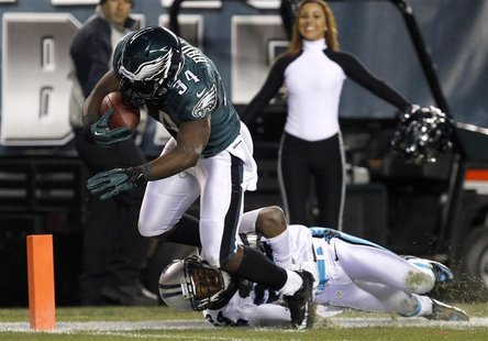 Philadelphia Eagles running back Bryce Brown (34) scores a touchdown as the Carolina Panthers cornerback Josh Norman (24) tries to make the Philadelphia Eagles running back Bryce Brown (34) scores a touchdown as the Carolina Panthers cornerback Josh Norman (24) tries to make the