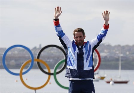 Gold medallist Britain's Ben Ainslie smiles during the men's finn class one person dinghy (heavyweight) sailing medal race victory ceremony Gold medallist Britain's Ben Ainslie smiles during the men's finn class one person dinghy (heavyweight) sailing medal race victory ceremony