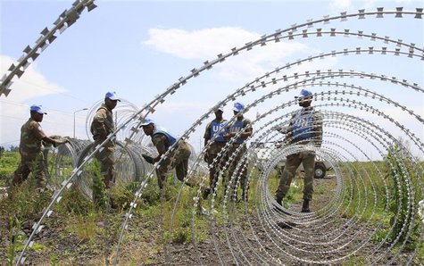The South Africa contingent of the U.N. peacekeepers in Congo erect a razor wire barrier around Goma airport in the Democratic Republic of C The South Africa contingent of the U.N. peacekeepers in Congo erect a razor wire barrier around Goma airport in the Democratic Republic of C