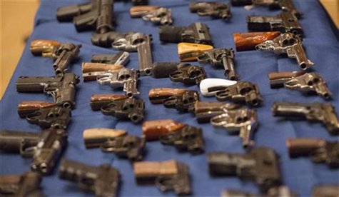 A view shows confiscated guns on a table during a news conference in New York October 12, 2012. REUTERS/Andrew Kelly A view shows confiscated guns on a table during a news conference in New York October 12, 2012. REUTERS/Andrew Kelly