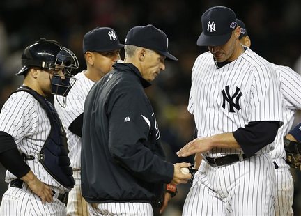 New York Yankees starting pitcher Andy Pettitte (R) is relieved by manager Joe Girardi as catcher Russell Martin (L) and third baseman Alex New York Yankees starting pitcher Andy Pettitte (R) is relieved by manager Joe Girardi as catcher Russell Martin (L) and third baseman Alex