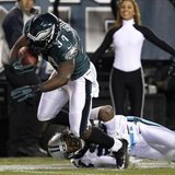 Philadelphia Eagles running back Bryce Brown (34) scores a touchdown as the Carolina Panthers cornerback Josh Norman (24) tries to make the tackle during the second quarter of their NFL football game in Philadelphia, Pennsylvania November 26, 2012. REUTERS/Tim Shaffer