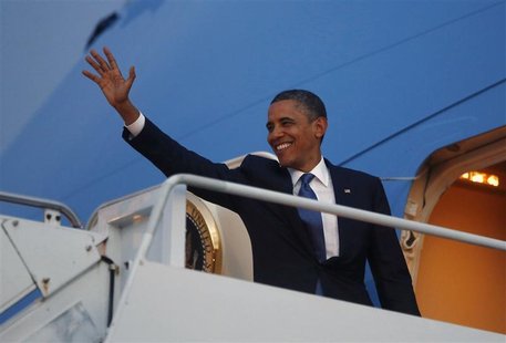 U.S. President Barack Obama waves from Air FOrce One as he prepares to return to the United States following the East Asia Summit in Phnom P U.S. President Barack Obama waves from Air FOrce One as he prepares to return to the United States following the East Asia Summit in Phnom P