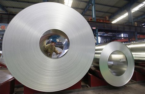An employee checks on a steel product at a steel production factory in Wuhan, Hubei province, August 2, 2012. REUTERS/Stringer An employee checks on a steel product at a steel production factory in Wuhan, Hubei province, August 2, 2012. REUTERS/Stringer
