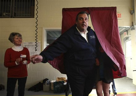 Poll worker Annie Barr watches as Governor Chris Christie exits the voting booth with his daughter Bridget, 8, at the Mendham Emergency Serv Poll worker Annie Barr watches as Governor Chris Christie exits the voting booth with his daughter Bridget, 8, at the Mendham Emergency Serv