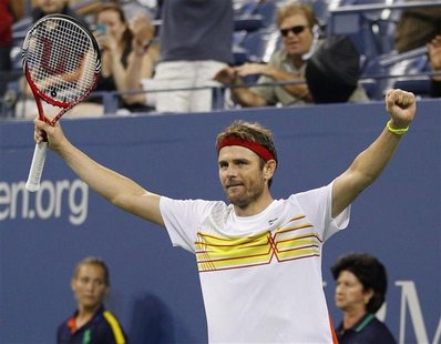 Mardy Fish of the U.S. celebrates defeating Gilles Simon of France during their match at the US Open men's singles tennis tournament in New Mardy Fish of the U.S. celebrates defeating Gilles Simon of France during their match at the US Open men's singles tennis tournament in New