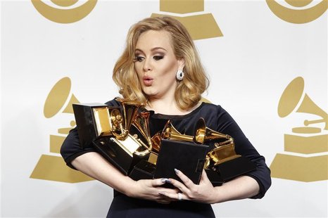 Singer Adele holds her six Grammy Awards at the 54th annual Grammy Awards in Los Angeles, California February 12, 2012. REUTERS/Lucy Nichols Singer Adele holds her six Grammy Awards at the 54th annual Grammy Awards in Los Angeles, California February 12, 2012. REUTERS/Lucy Nichols