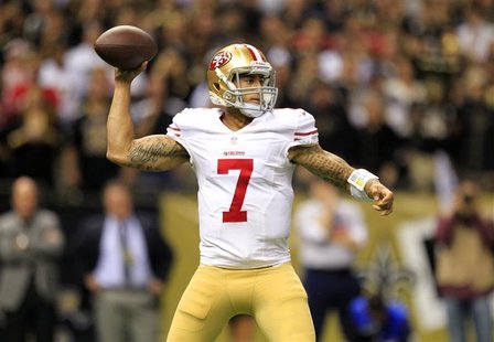 San Francisco 49ers quarterback Colin Kaepernick (7) drops back to pass against the New Orleans Saints during the second half of their NFL f San Francisco 49ers quarterback Colin Kaepernick (7) drops back to pass against the New Orleans Saints during the second half of their NFL f