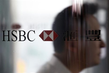 A man walks past the HSBC logo at the bank's headquarters in Hong Kong September 8, 2011. REUTERS/Tyrone Siu A man walks past the HSBC logo at the bank's headquarters in Hong Kong September 8, 2011. REUTERS/Tyrone Siu