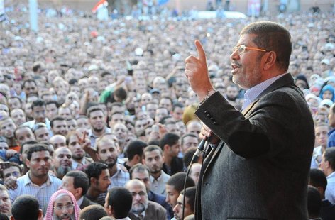 Egypt's President Mohamed Mursi speaks to supporters in front of the presidential palace in Cairo November 23, 2012. Mursi's decision to ass Egypt's President Mohamed Mursi speaks to supporters in front of the presidential palace in Cairo November 23, 2012. Mursi's decision to ass