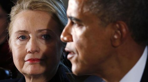 U.S. Secretary of State Hillary Clinton (L) listens to U.S. President Barack Obama speak during a meeting with members of his cabinet at the U.S. Secretary of State Hillary Clinton (L) listens to U.S. President Barack Obama speak during a meeting with members of his cabinet at the