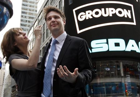 Groupon CEO Andrew Mason poses with his newly married wife, pop musician Jenny Gillespie, outside the Nasdaq Market following his company's Groupon CEO Andrew Mason poses with his newly married wife, pop musician Jenny Gillespie, outside the Nasdaq Market following his company's