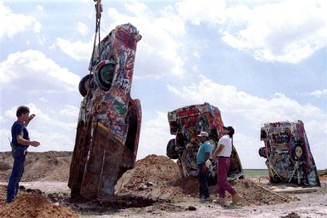 One of ten Cadillac automobiles from the "Cadillac Ranch" art installation is lowered into the ground at its new home near Amarillo, Texas, One of ten Cadillac automobiles from the "Cadillac Ranch" art installation is lowered into the ground at its new home near Amarillo, Texas,