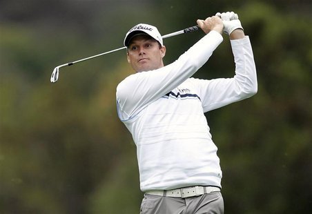 Nick Watney of the U.S. hits his approach shot to the 18th green during the first round of the World Challenge golf tournament in Thousand O Nick Watney of the U.S. hits his approach shot to the 18th green during the first round of the World Challenge golf tournament in Thousand O