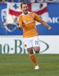 Houston Dynamo midfielder Brad Davis (11) celebrates after scoring against Montreal Impact during the first half of their MLS soccer match i Houston Dynamo midfielder Brad Davis (11) celebrates after scoring against Montreal Impact during the first half of their MLS soccer match i