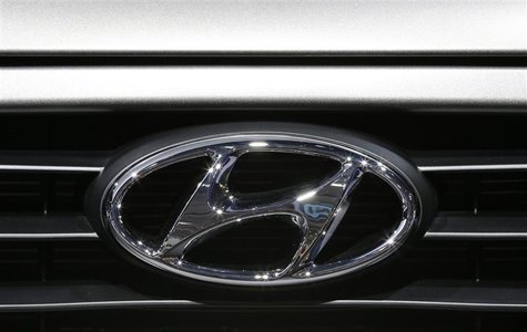 A Hyundai logo is seen on a car at the Paris Mondial de l'Automobile, September 28, 2012. The Paris auto show opens its doors to the public A Hyundai logo is seen on a car at the Paris Mondial de l'Automobile, September 28, 2012. The Paris auto show opens its doors to the public