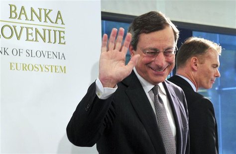 European Central Bank President Mario Draghi (C) waves after a news conference after the Governing Council Meeting of the European Central B European Central Bank President Mario Draghi (C) waves after a news conference after the Governing Council Meeting of the European Central B