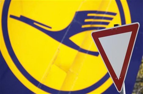 A yield traffic sign is pictured next to a Lufthansa logo at Frankfurt Airport April 18, 2010. REUTERS/Johannes Eisele A yield traffic sign is pictured next to a Lufthansa logo at Frankfurt Airport April 18, 2010. REUTERS/Johannes Eisele