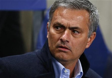 Real Madrid's manager Jose Mourinho watches the warmup before the Champions League Group D soccer match against Manchester City at The Etiha Real Madrid's manager Jose Mourinho watches the warmup before the Champions League Group D soccer match against Manchester City at The Etiha