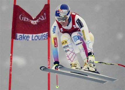 U.S. skier Lindsey Vonn speeds past a gate in the fog during the first Women's World Cup downhill skiing race of the season in Lake Louise, U.S. skier Lindsey Vonn speeds past a gate in the fog during the first Women's World Cup downhill skiing race of the season in Lake Louise,
