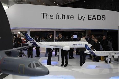 Visitors look at aircraft models at the EADS booth during the ILA Berlin Air Show in Selchow near Schoenefeld south of Berlin, September 13, Visitors look at aircraft models at the EADS booth during the ILA Berlin Air Show in Selchow near Schoenefeld south of Berlin, September 13,