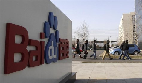 Employees walk past the logo of Baidu outside its headquarters in Beijing, December 15, 2010. REUTERS/Soo Hoo Zheyang Employees walk past the logo of Baidu outside its headquarters in Beijing, December 15, 2010. REUTERS/Soo Hoo Zheyang