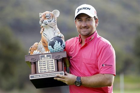 Graeme McDowell of Northern Ireland poses with his trophy after winning the World Challenge golf tournament in Thousand Oaks, California, De Graeme McDowell of Northern Ireland poses with his trophy after winning the World Challenge golf tournament in Thousand Oaks, California, De