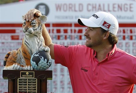 Graeme McDowell of Northern Ireland poses with his trophy after winning the World Challenge golf tournament in Thousand Oaks, California, De Graeme McDowell of Northern Ireland poses with his trophy after winning the World Challenge golf tournament in Thousand Oaks, California, De