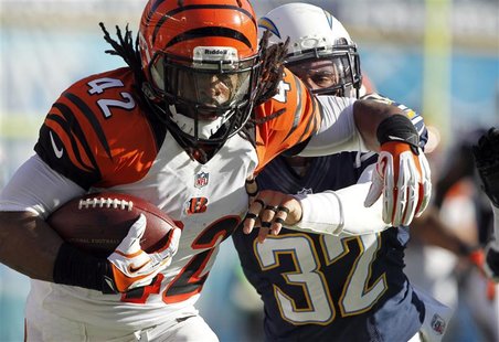 Cincinnati Bengals running back BenJarvus Green-Ellis (42) is pushed out-of-bounds by San Diego Chargers free safety Eric Weddle (32) after Cincinnati Bengals running back BenJarvus Green-Ellis (42) is pushed out-of-bounds by San Diego Chargers free safety Eric Weddle (32) after