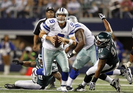 Dallas Cowboys quarterback Tony Romo scrambles as Philadelphia Eagles defensive tackle Cullen Jenkins is unable to make the tackle in the fi Dallas Cowboys quarterback Tony Romo scrambles as Philadelphia Eagles defensive tackle Cullen Jenkins is unable to make the tackle in the fi