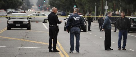 Los Angeles police and robbery homicide detectives investigate the shooting scene where four people were shot and killed in Northridge, Cali Los Angeles police and robbery homicide detectives investigate the shooting scene where four people were shot and killed in Northridge, Cali