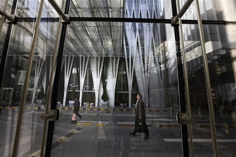 People walk at the China World Trade Center in Beijing's central business district, November 29, 2012. REUTERS/Jason Lee People walk at the China World Trade Center in Beijing's central business district, November 29, 2012. REUTERS/Jason Lee