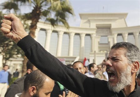 A supporter of Egypt's President Mohamed Mursi gestures during a rally in front of the Supreme Constitutional Court in Maadi, south of Cairo A supporter of Egypt's President Mohamed Mursi gestures during a rally in front of the Supreme Constitutional Court in Maadi, south of Cairo