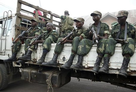 Government army FARDC soldiers drive in trucks as they arrive in Goma December 3, 2012. REUTERS/Goran Tomasevic Government army FARDC soldiers drive in trucks as they arrive in Goma December 3, 2012. REUTERS/Goran Tomasevic