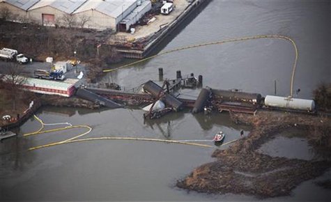 Derailed freight train cars sit semi-submerged in the waters of Mantua Creek after a train crash in Paulsboro, New Jersey November 30, 2012. Derailed freight train cars sit semi-submerged in the waters of Mantua Creek after a train crash in Paulsboro, New Jersey November 30, 2012.