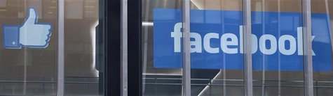 The Facebook "thumbs up" icon and logo are displayed in a window at the offices of J.P. Morgan in New York City, New York, May 4, 2012. REUT The Facebook "thumbs up" icon and logo are displayed in a window at the offices of J.P. Morgan in New York City, New York, May 4, 2012. REUT