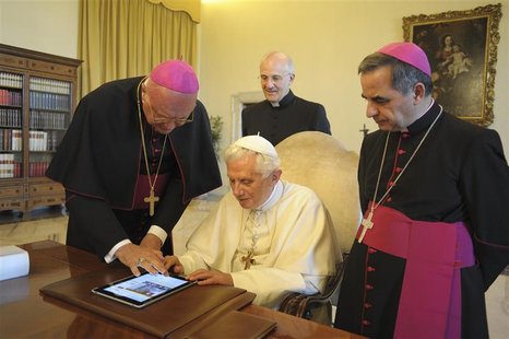Pope Benedict XVI uses an iPad device at the Vatican in this file photo dated June 28, 2011. Pope Benedict's handle on Twitter will be @pont Pope Benedict XVI uses an iPad device at the Vatican in this file photo dated June 28, 2011. Pope Benedict's handle on Twitter will be @pont