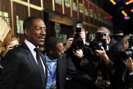 Actor Eddie Murphy (L) poses as he arrives for the taping of the Spike TV special tribute "Eddie Murphy: One Night Only" at the Saban theatr Actor Eddie Murphy (L) poses as he arrives for the taping of the Spike TV special tribute "Eddie Murphy: One Night Only" at the Saban theatr